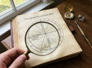 A magnifying glass hovering over an open book displaying a hand-drawn astrology chart, illustrating the process of decoding the visual anatomy and geometry of the wheel.